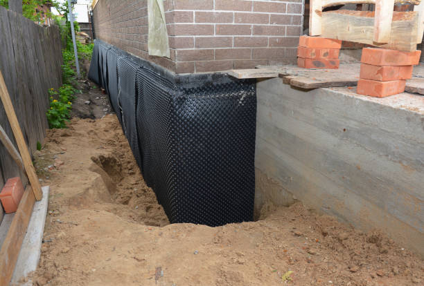 Happy homeowners after waterproofing job in Moss